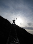SX20981 Silhouette Wouko jumping, Moel Arthur hillfort.jpg